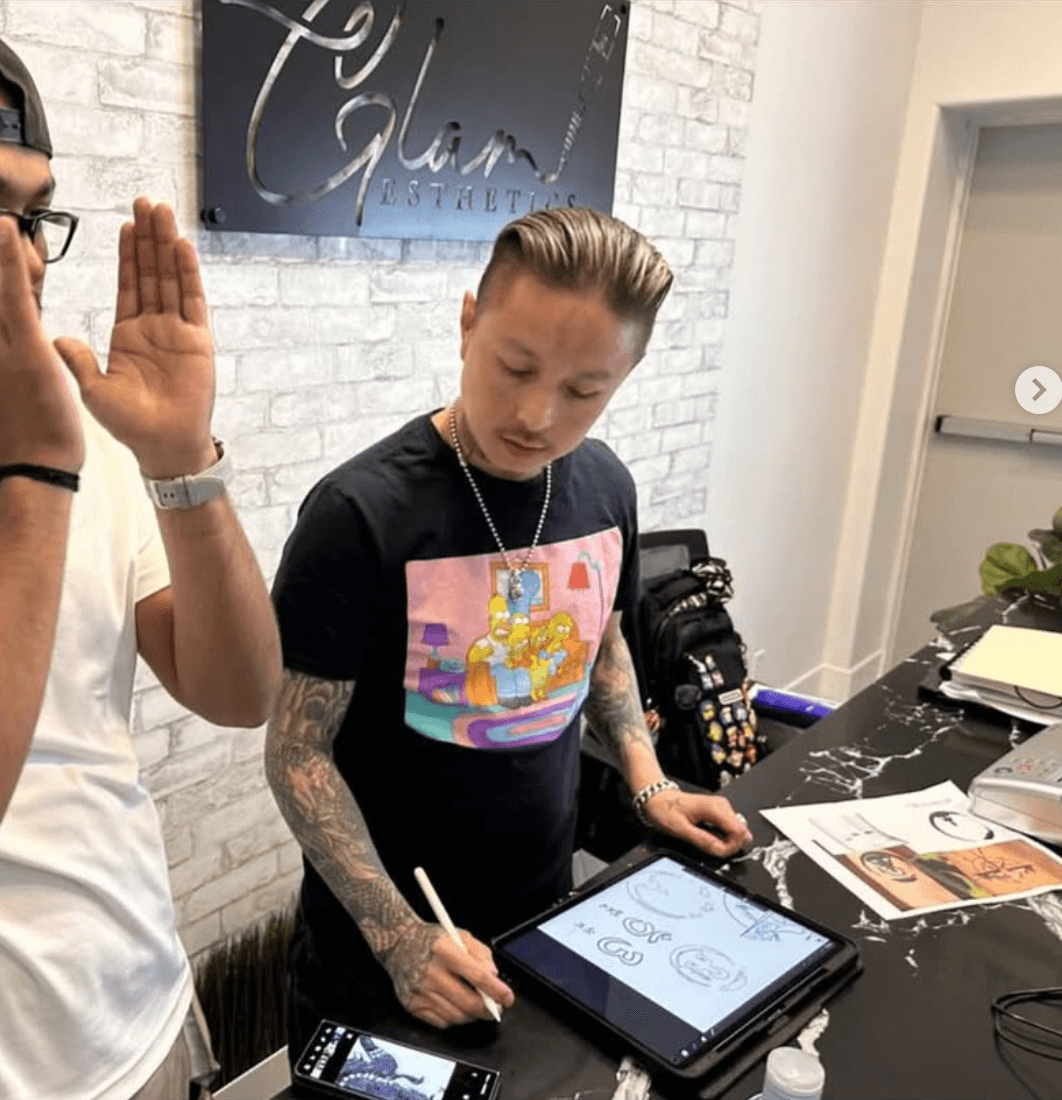 Tony Luong tattooing a client at Raining Ink Tattoo studio Maple Valley WA